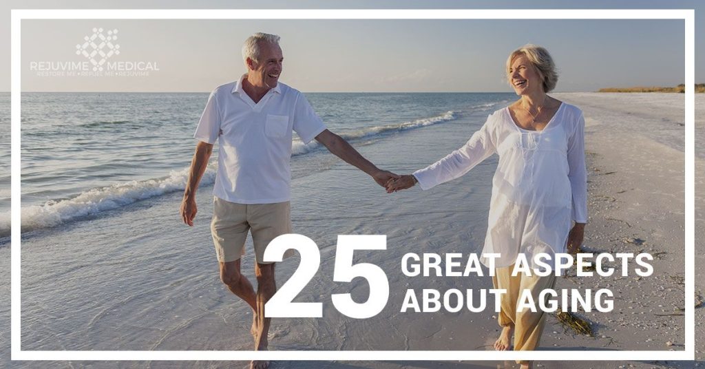 Older couple holding hands on beach