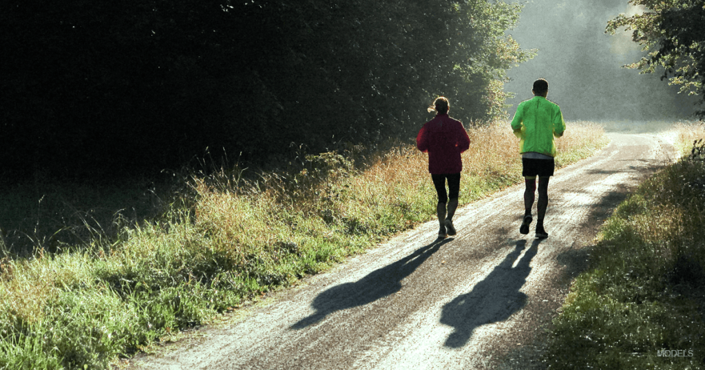 Couple running in the wilderness