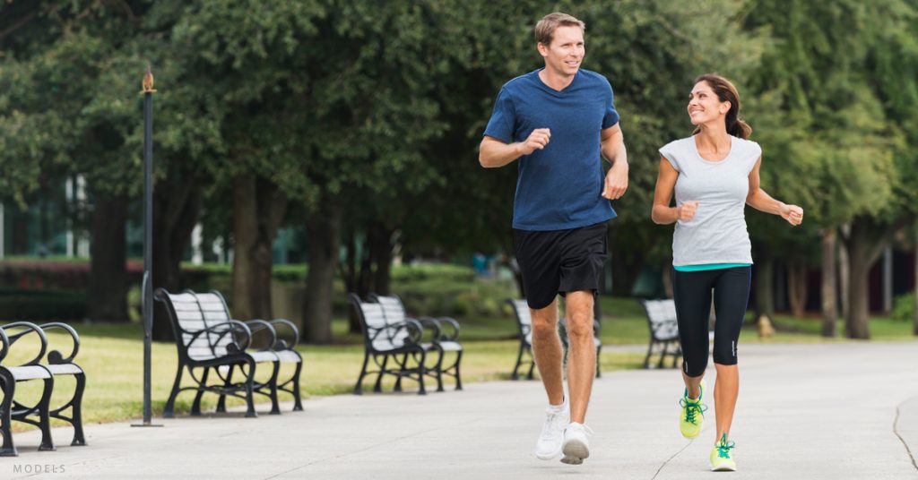 A man and woman go for a walk as part of their New Year's resolution to combat signs of aging.