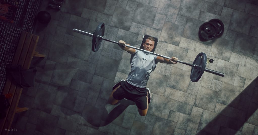 Overhead view of a man on a bench press.